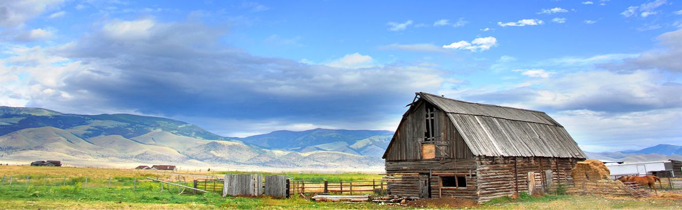 Barn with mountain scene