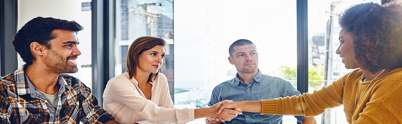 business men women shaking hands
